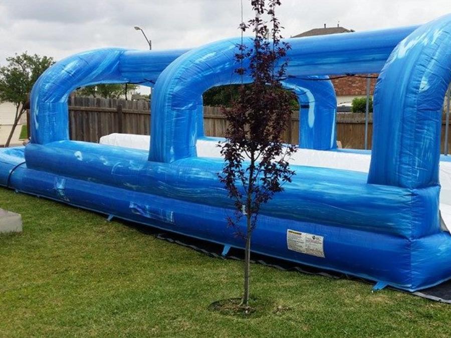 Inflatable slip n slide rental Austin TX - long water slide Jump Around Party Rentals